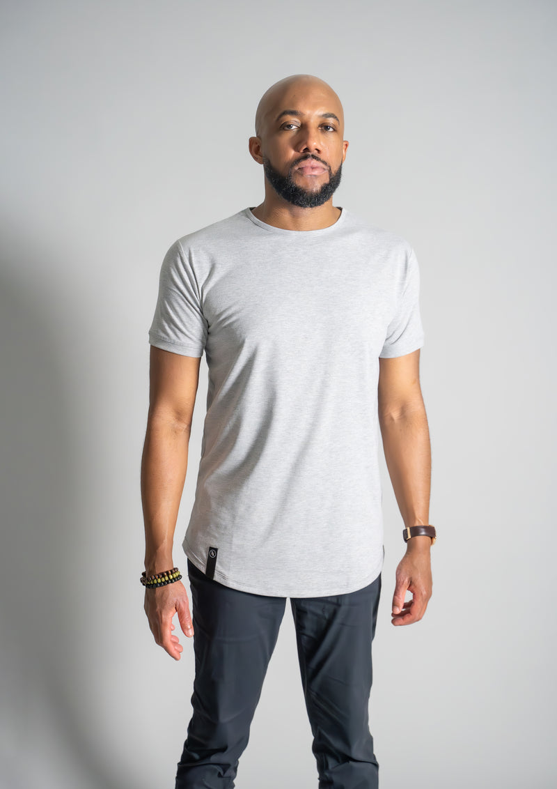 Male model in a heather grey curved bottom shirt from ten10 apparel