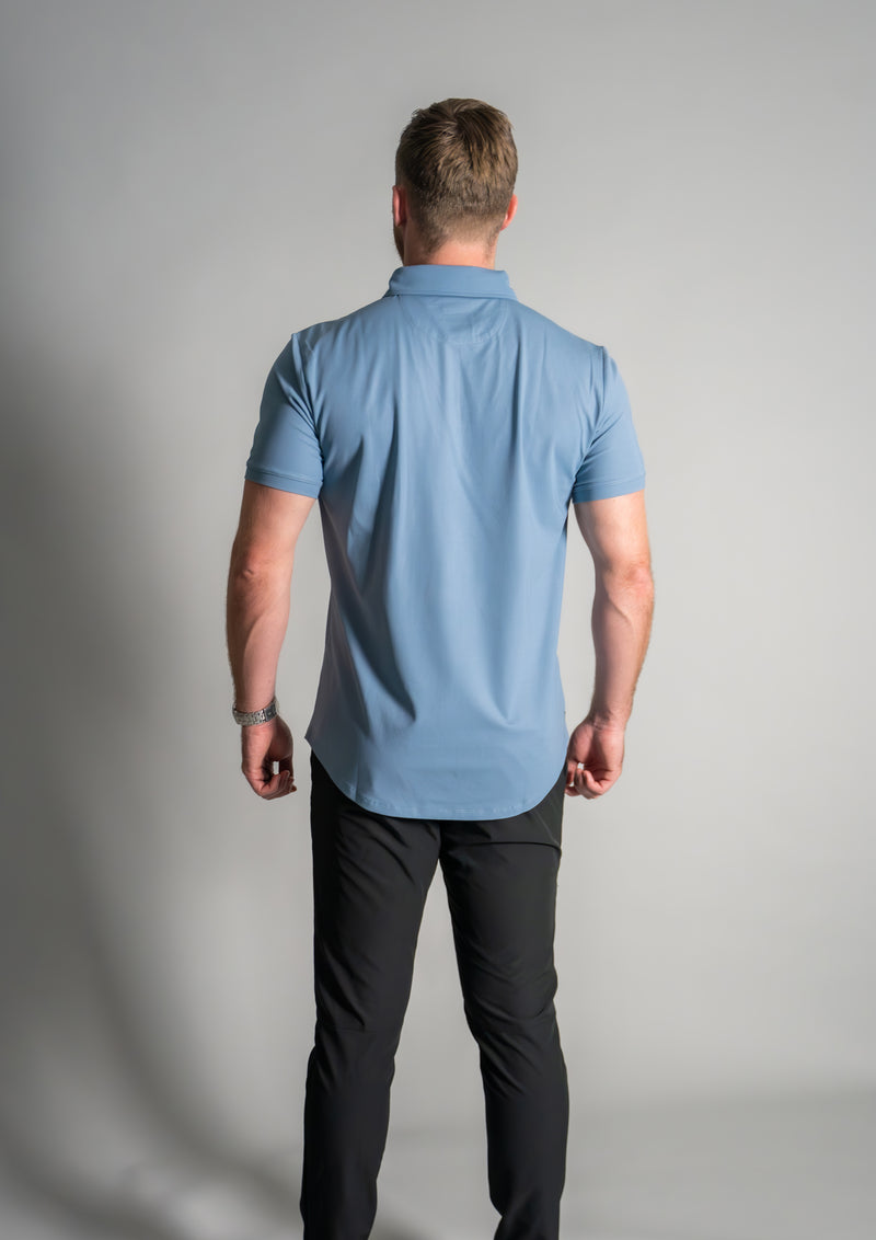 Male model in True Blue Stratus Polo from Ten Ten apparel with back turned