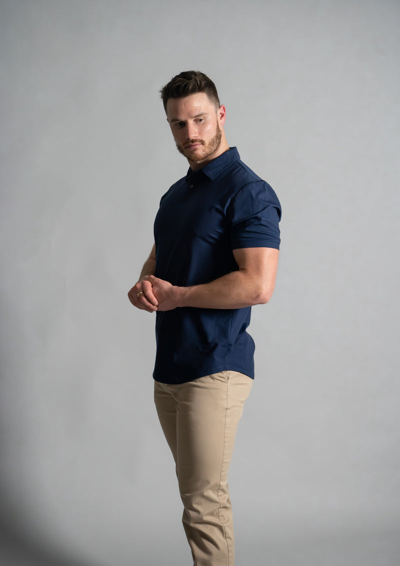 Stratus Men's polo in oxford blue focusing on fitted arms