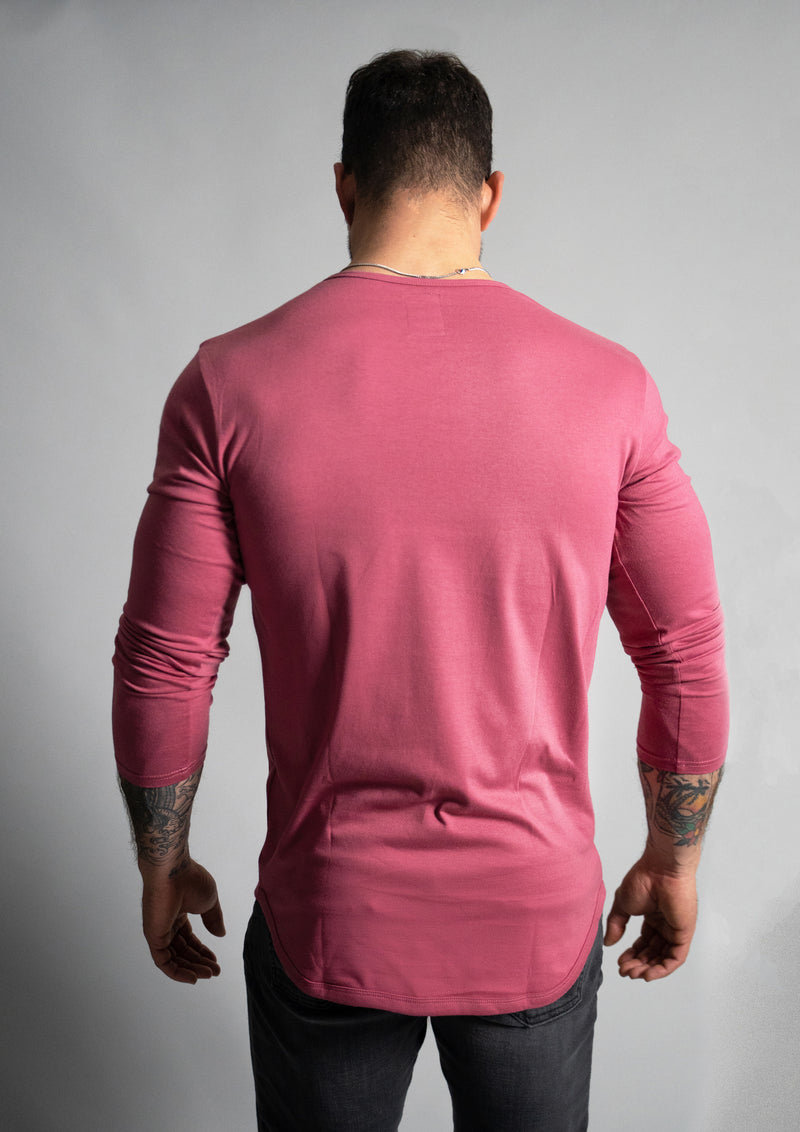 Back view of the rosewood dark/washed pink color with male model. Male has tattoos seen on the forearms