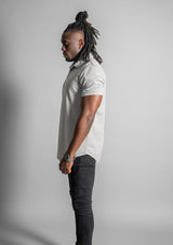 side view of male model in gray polo from Ten/10 apparel