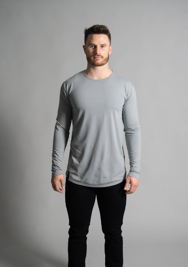 Male model in fitted Longsleeve curved hem bottom grey shirt from ten10 apparel