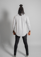 back view of model in a mens henley long sleeve of color gray