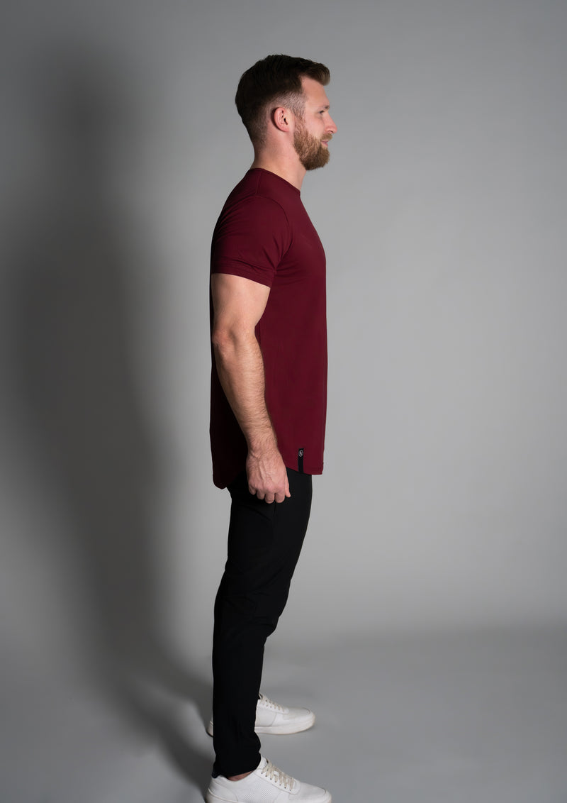 Side view of male model in a drop cut tee from 10 10 apparel