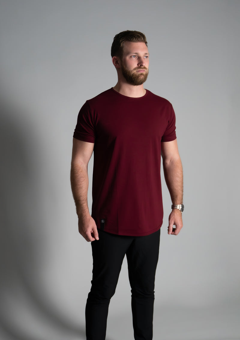 Male model in mahogany curved hem t-shirt from ten10 apparel