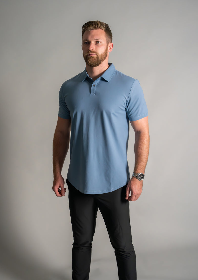 Male model looking in distance in Oasis men's premium polo from 10 10 apparel