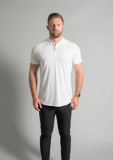 Male model facing forward in white mock neck polo from ten20 apparel