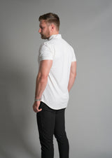 Back of mock neck ares polo in white, model facing away from the camera