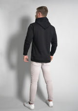 male model with back to camera with a soft black oversized hoodie for men