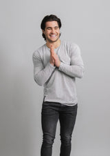 Male model in gray form fitting athletic fitting long sleeve crew neck shirt from 1010 apparel