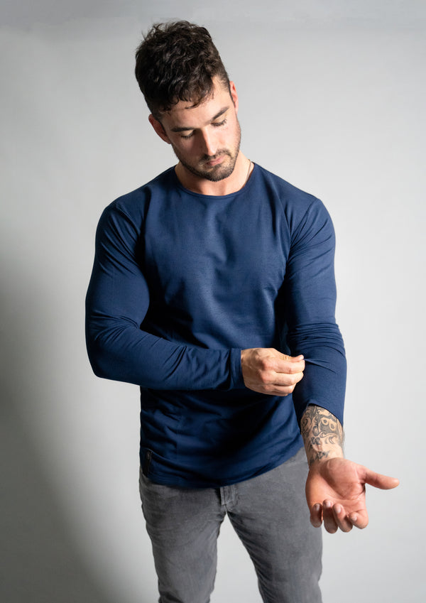 Male model with Ten Ten apparel navy blue curved hem long sleeve on