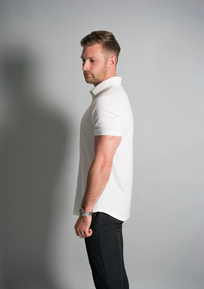 Side view of male model in a white polo from Ten10 apparel