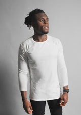 American male model with a white split hem long sleeve shirt with a front view