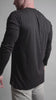 Close of video of black long sleeve split hem shirt by ten10 apparel in slow motion, showing soft fabric features of the shirt