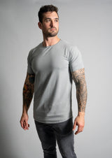 Male model in granite men's short sleeve grey crown neck drop cut tee from Ten/10 Apparel