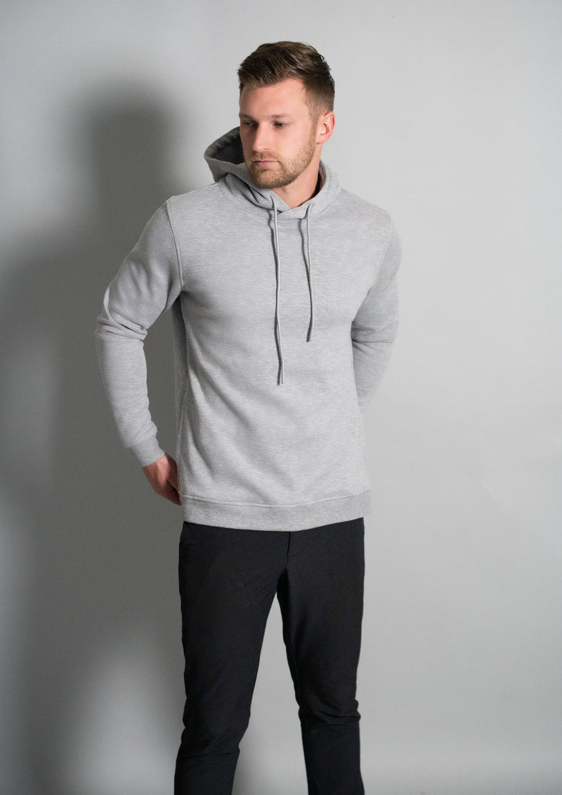 model in grey hoodie from ten 10 clothing facing to the right
