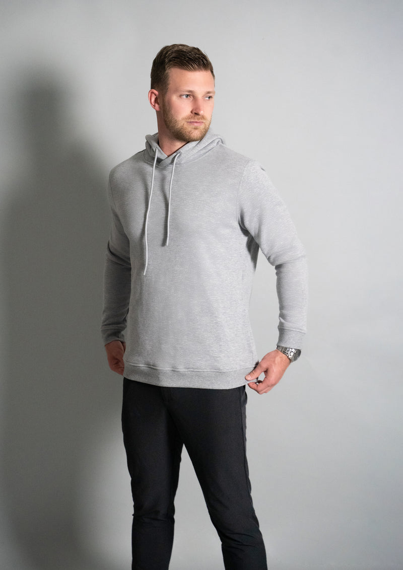Heather grey hoodie with model in the hoodie from ten 10 apparel
