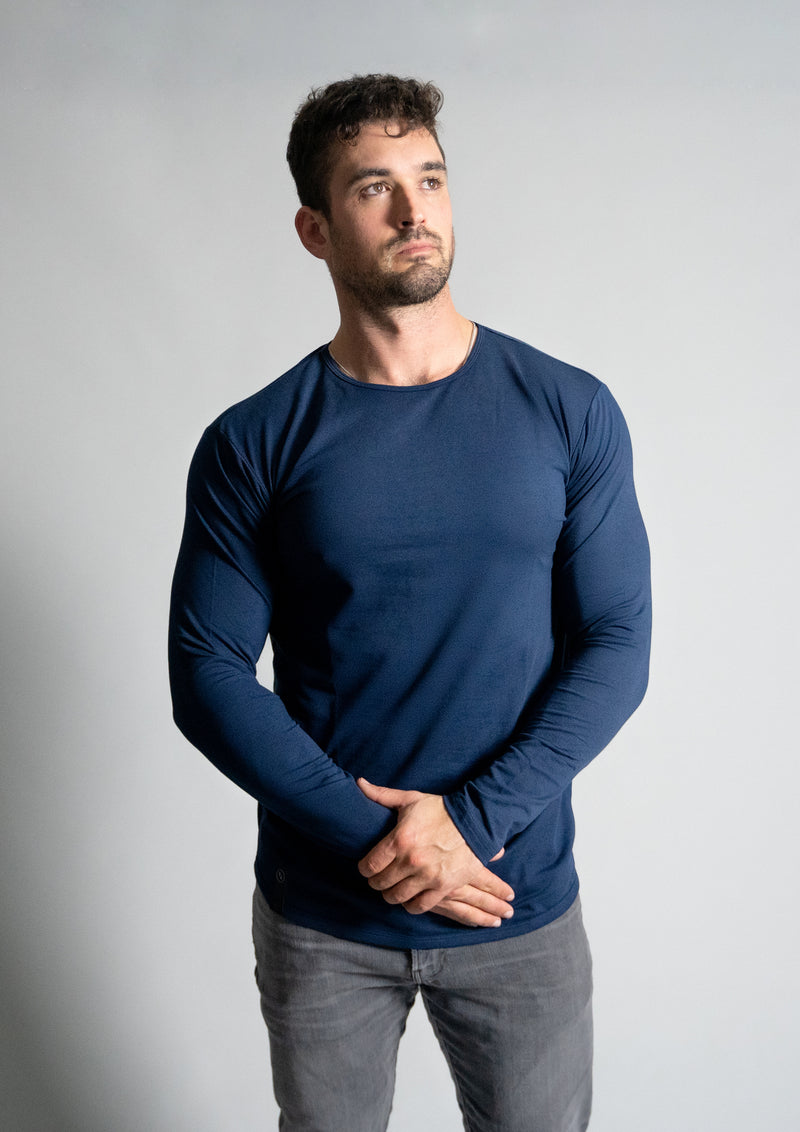 Men's curved Hem long sleeve in color navy Oxford blue from Ten 10 apparel with model in the long sleeve tee