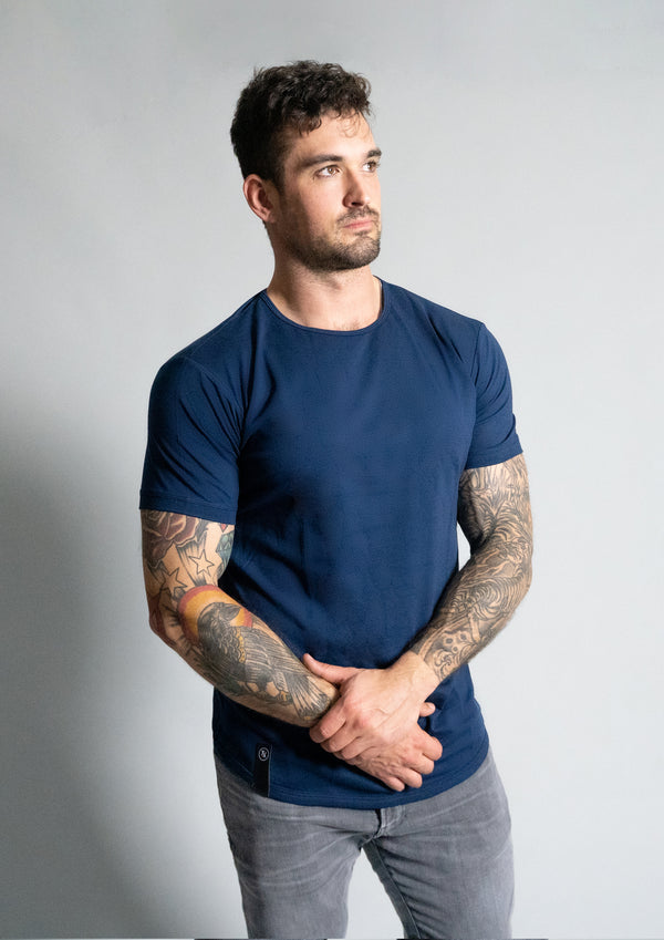 Men's Oxford Blue Shirt. Navy shirt with male model from Ten/10 apparel