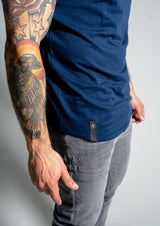Dark blue short sleeve crew neck showing Ten10 Apparel's logo on the bottom curve hem of the men's tee